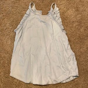 Light blue tank top with ruffle around the sleeves